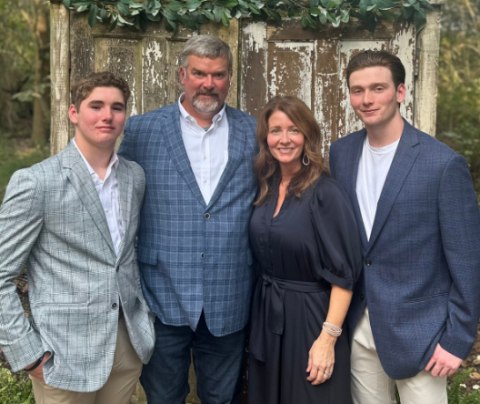 Photo of Laura Kappler-Roberts with her husband and two sons