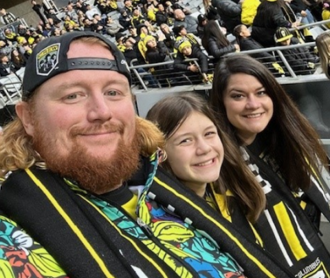 Photo of Corey Adams and his family at a Columbus Crew MLS game