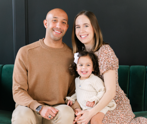Photo of Cara Cranston with her husband and young daughter